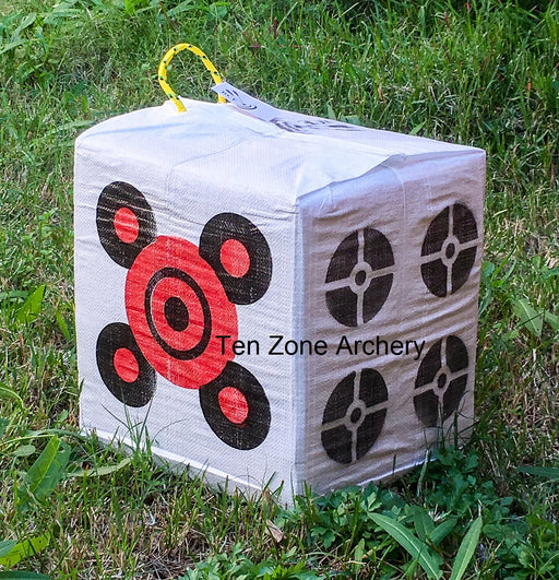 BCE economy compound bow target block with carry handle from Ten Zone Archery pictured outside on green grass.