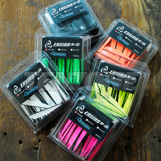 Six 100-packs, each of a different colour of Q2i X-II 3 inch vanes on a timber background. The Ten Zone Archery logo is visible as a watermark over the image.